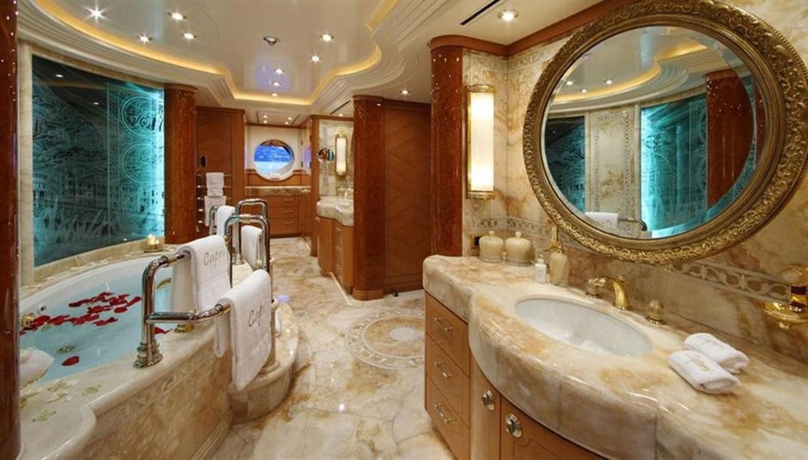 a bathroom with a large mirror aboard CAPRI I Yacht for Sale