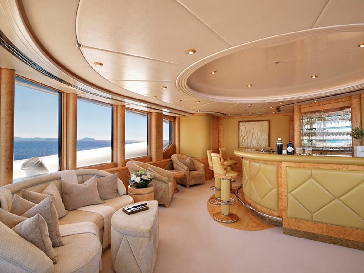 a living room with a large window aboard CAPRI I Yacht for Sale