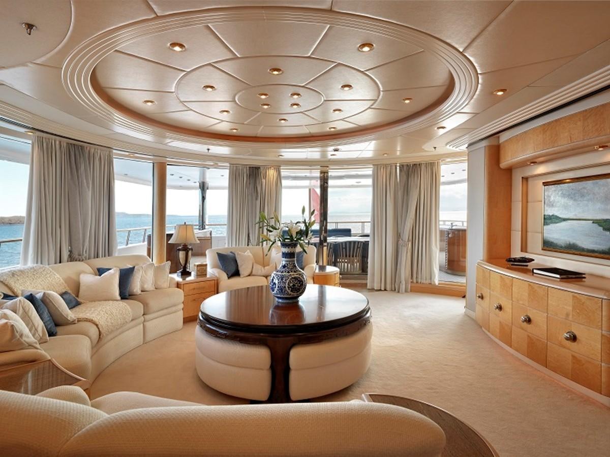 a living room with a large window aboard CAPRI I Yacht for Sale