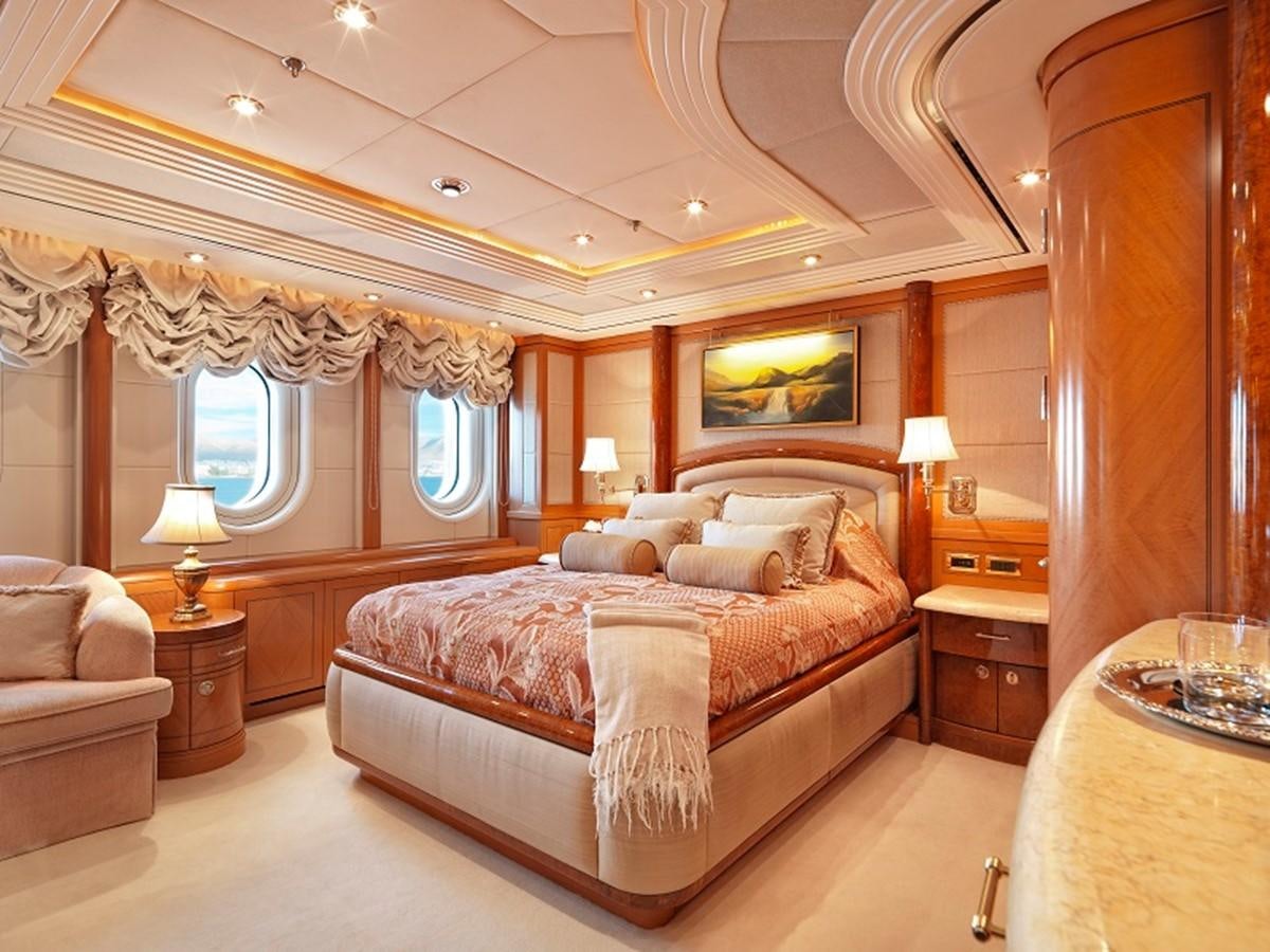 a large bedroom with a bed aboard CAPRI I Yacht for Sale