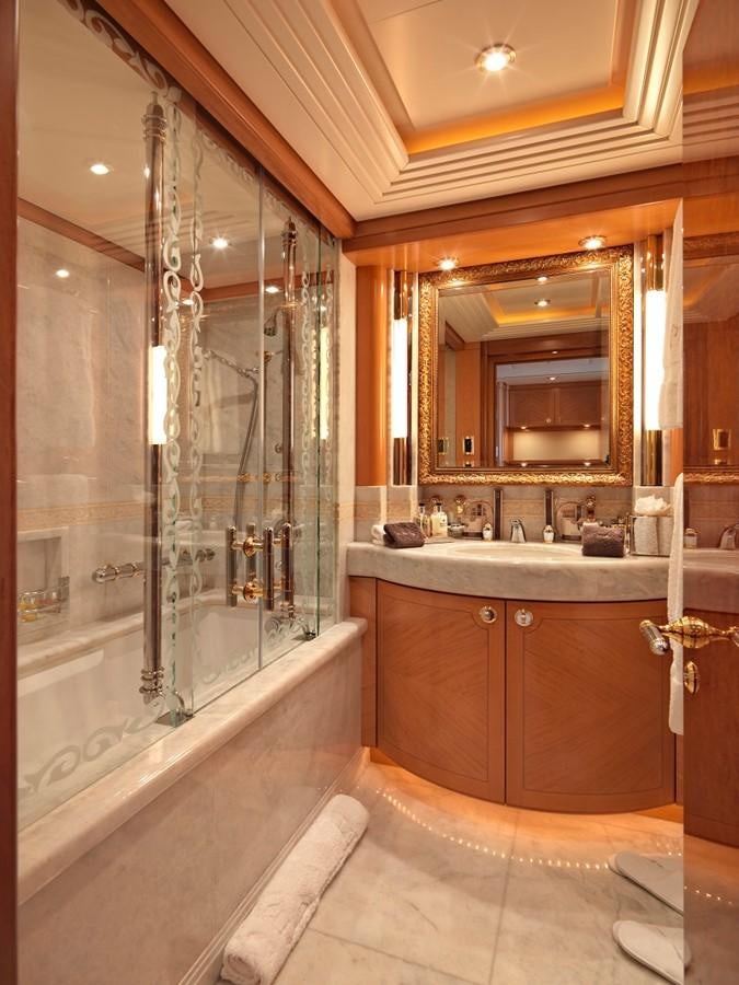 a bathroom with a glass shower aboard CAPRI I Yacht for Sale