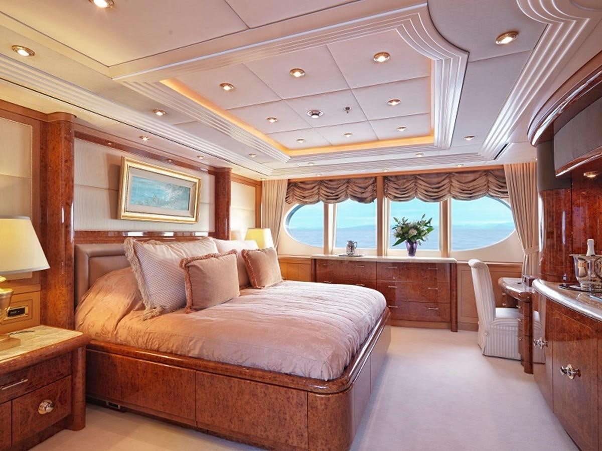 a large living room with a large bed aboard CAPRI I Yacht for Sale