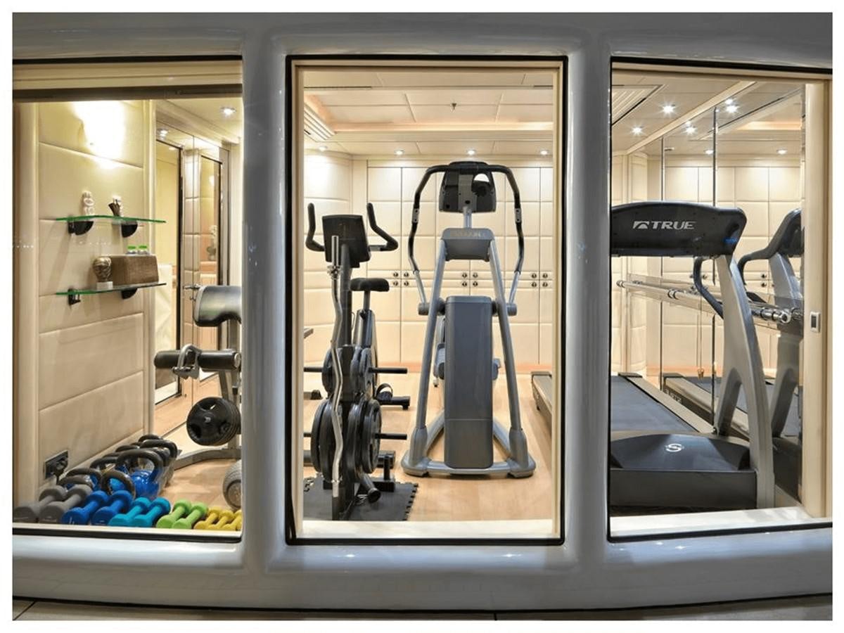 a mirror showing a gym aboard CAPRI I Yacht for Sale