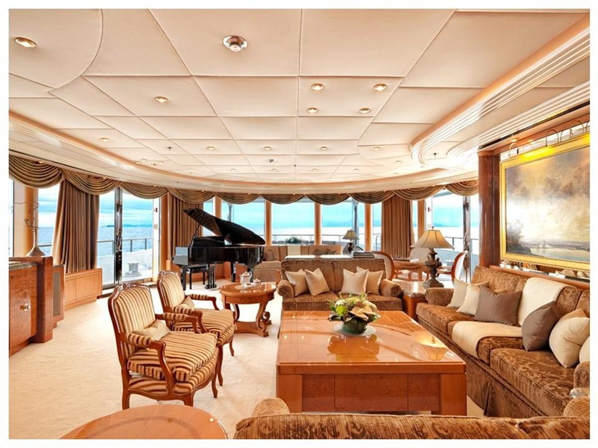 a living room with a large window aboard CAPRI I Yacht for Sale