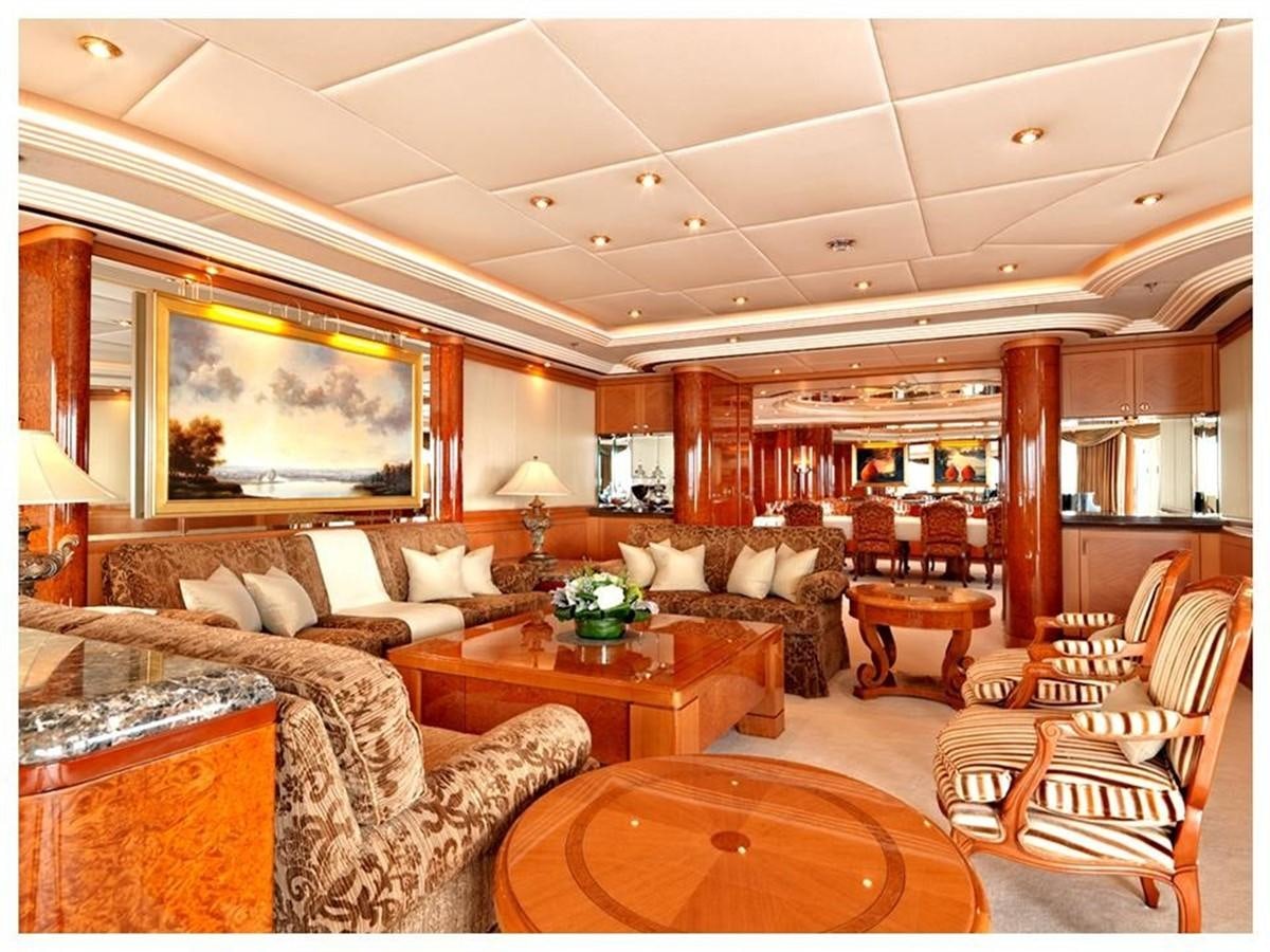 a living room with a large screen aboard CAPRI I Yacht for Sale
