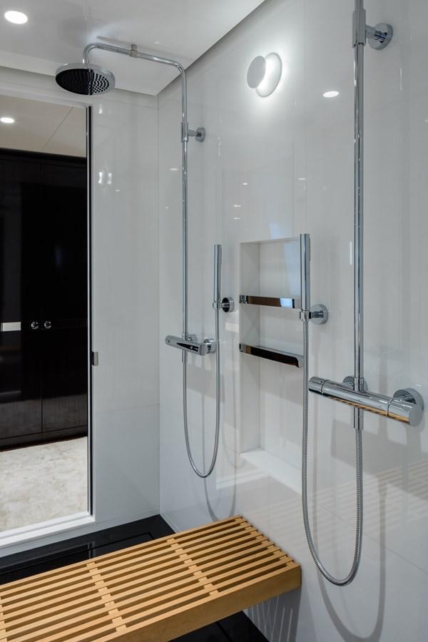 a shower unit in a bathroom aboard HALO Yacht for Sale