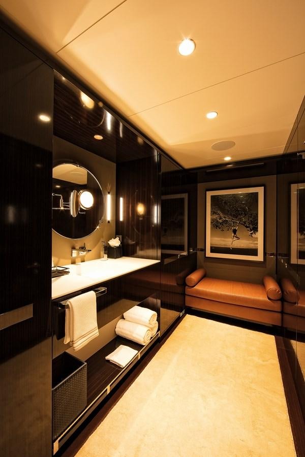 a bathroom with a large mirror aboard HALO Yacht for Sale