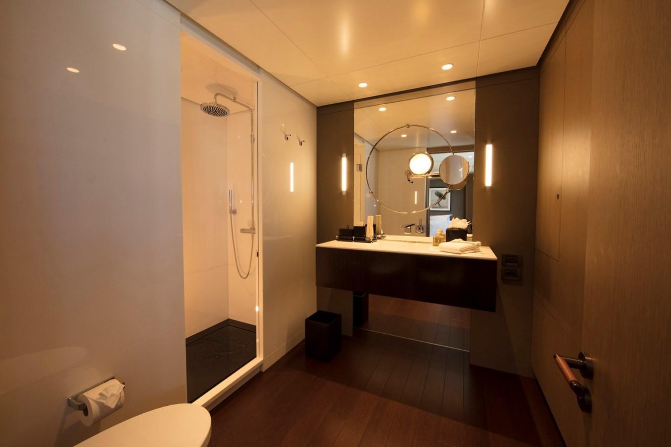 a bathroom with a large mirror aboard HALO Yacht for Sale