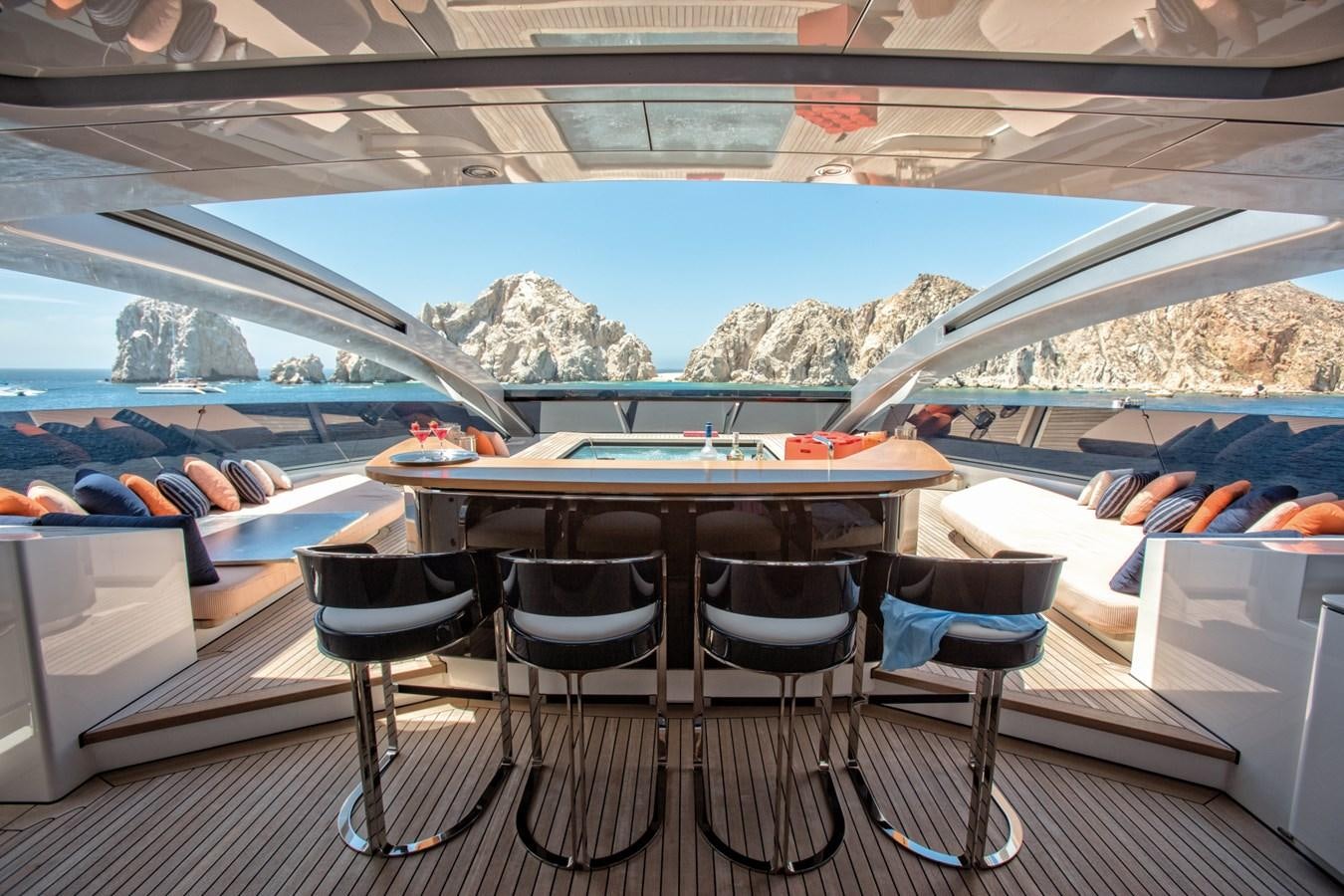a table and chairs in a room aboard HALO Yacht for Sale