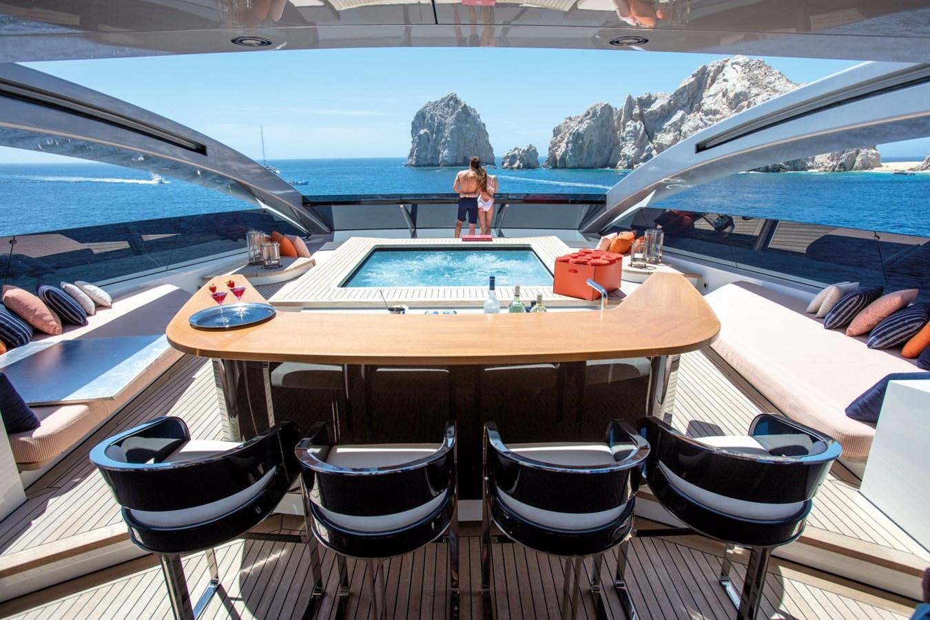 a table with chairs around it aboard HALO Yacht for Sale