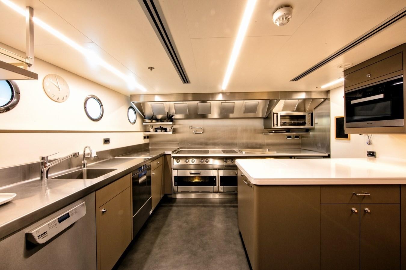 a kitchen with stainless steel appliances aboard HALO Yacht for Sale