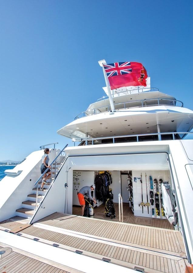 a boat with a flag on the top aboard HALO Yacht for Sale