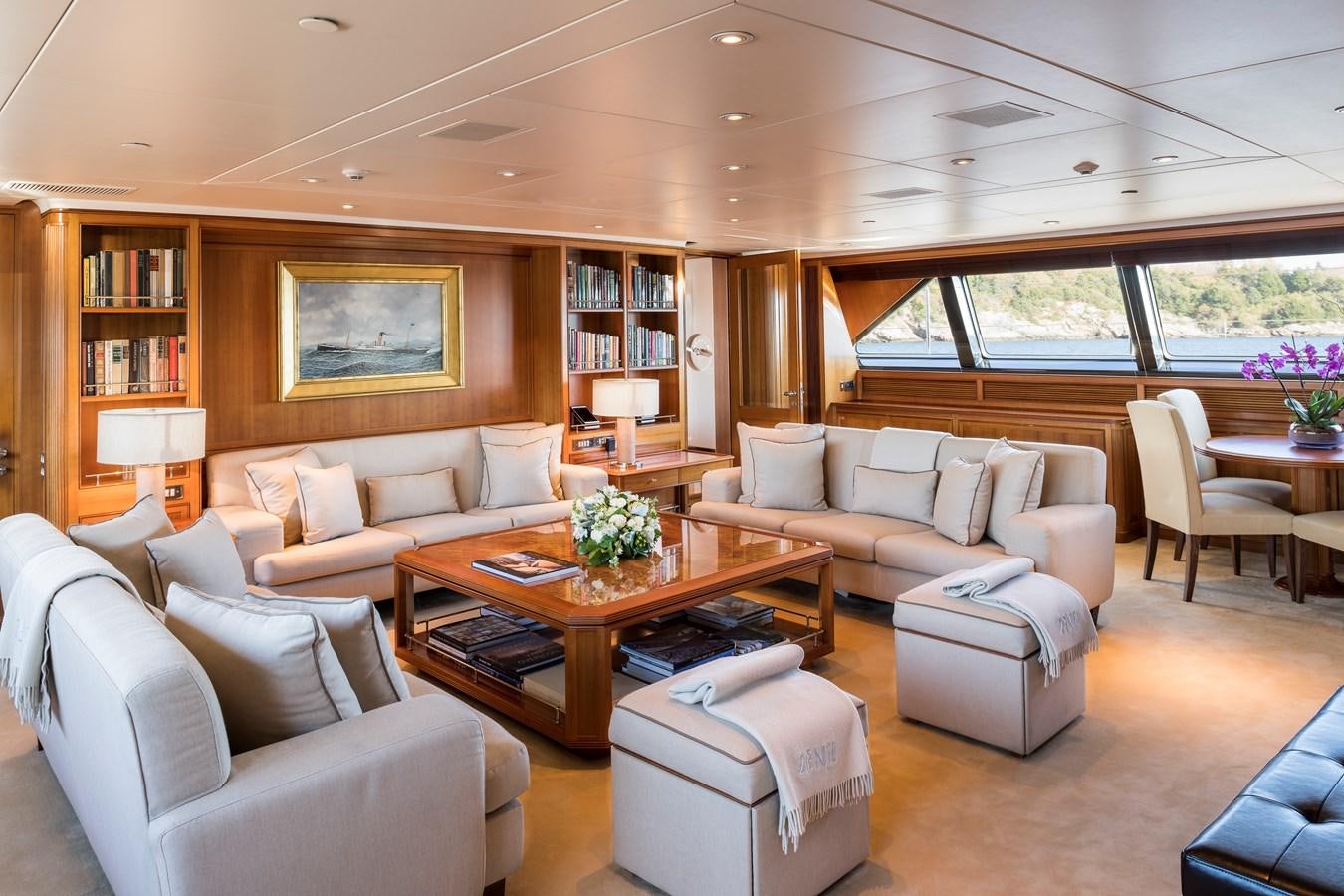 a living room with a couch and a coffee table aboard ZENJI Yacht for Sale