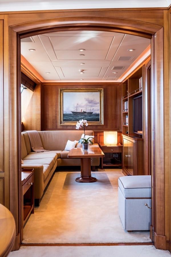 a living room with a couch and a table aboard ZENJI Yacht for Sale