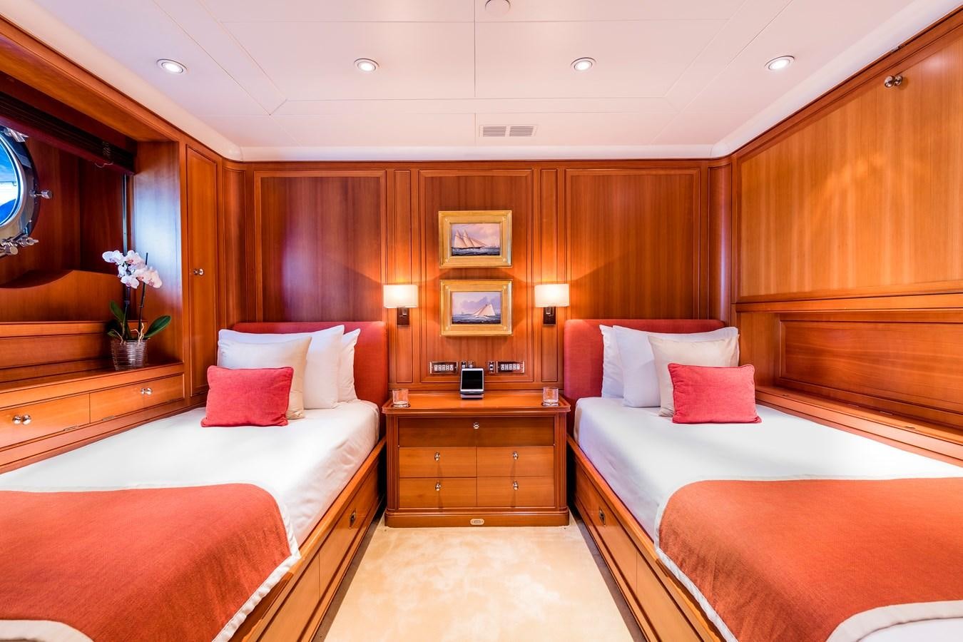 a room with a bed and a mirror aboard ZENJI Yacht for Sale
