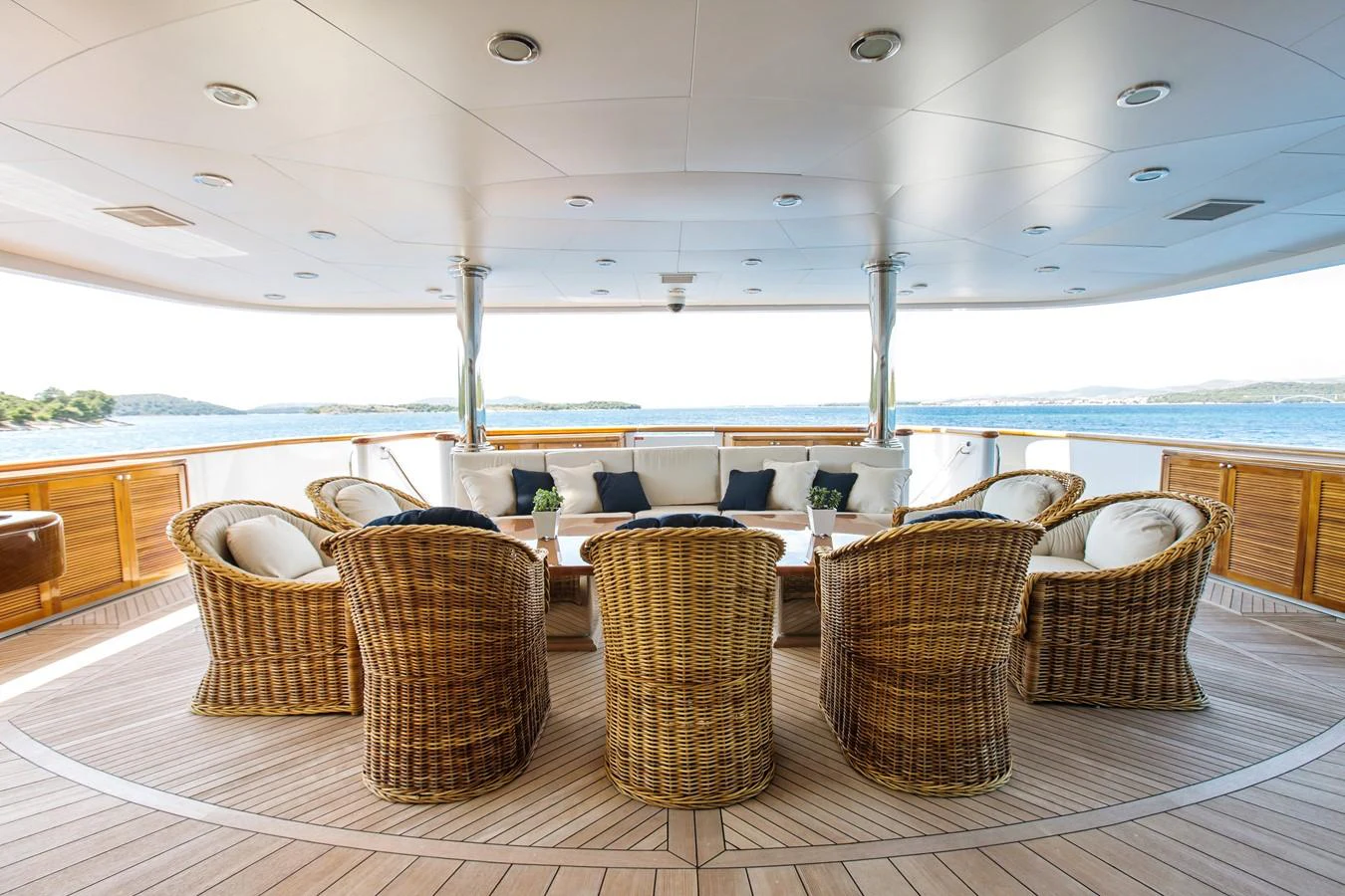 a room with chairs and tables aboard MUSTIQUE Yacht for Charter
