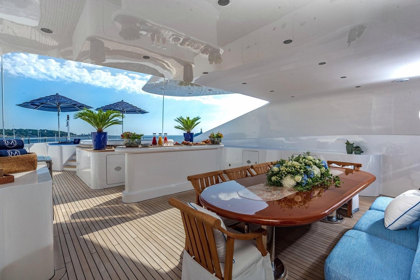 a room with a table and chairs aboard NEXT CHAPTER Yacht for Charter