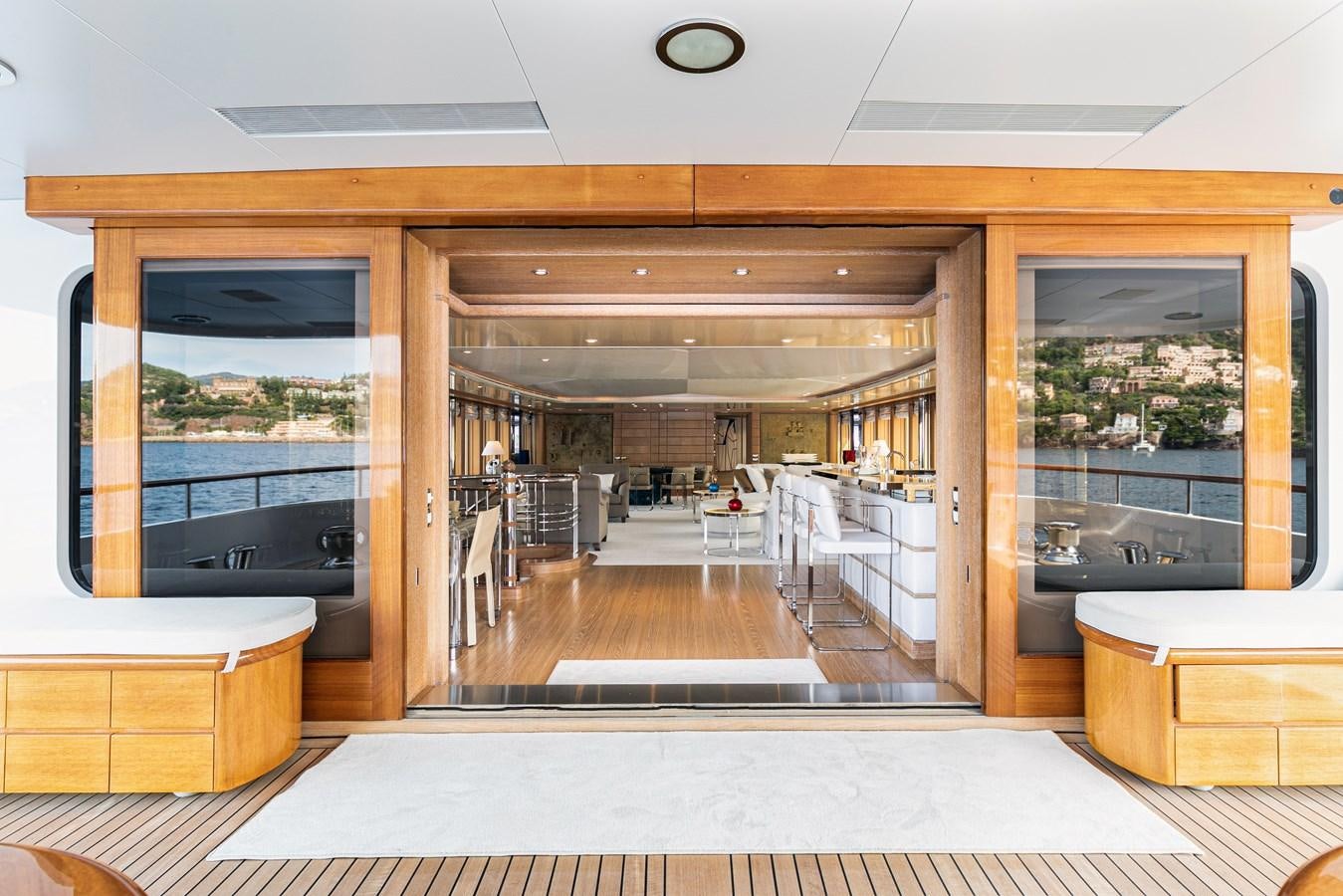 a room with a large glass door aboard SEA HUNTRESS Yacht for Sale