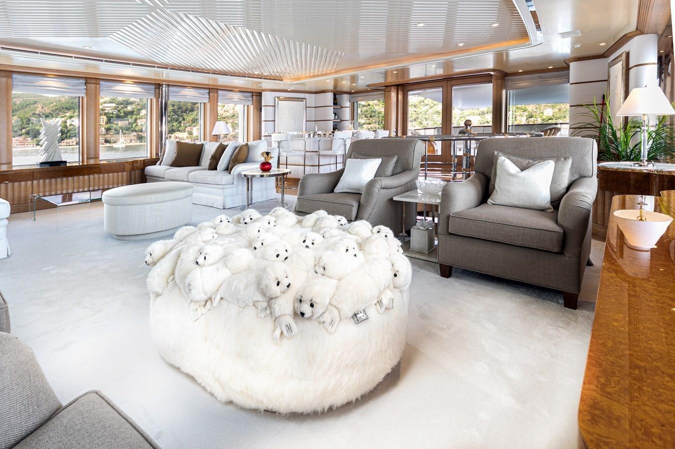 a large room with a large white fur rug and a large white fur rug aboard SEA HUNTRESS Yacht for Sale