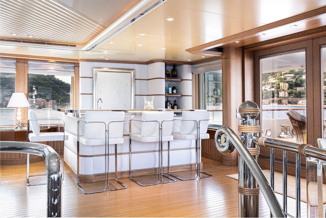 a room with chairs and tables aboard SEA HUNTRESS Yacht for Sale