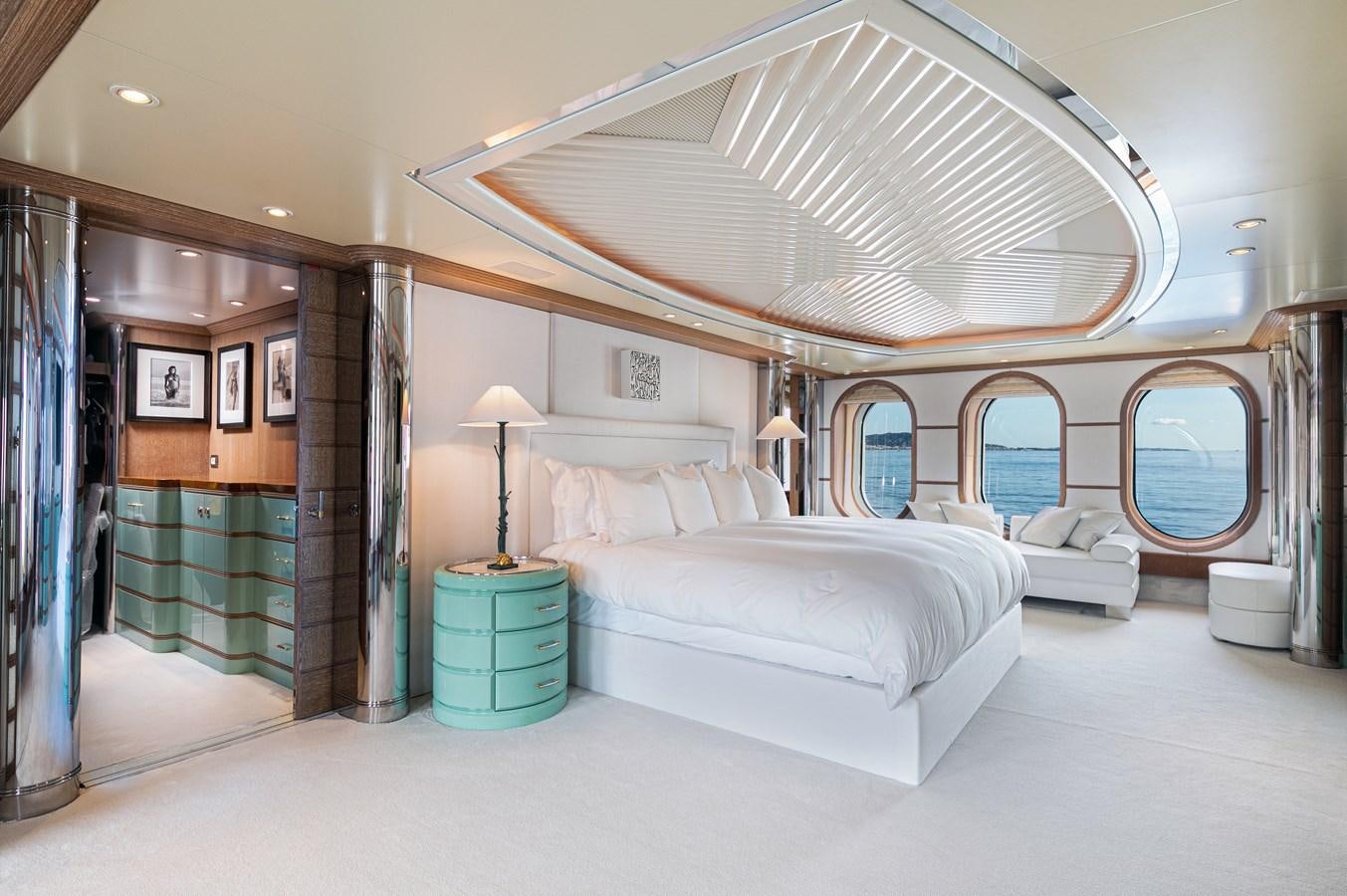a bedroom with a large bed aboard SEA HUNTRESS Yacht for Sale