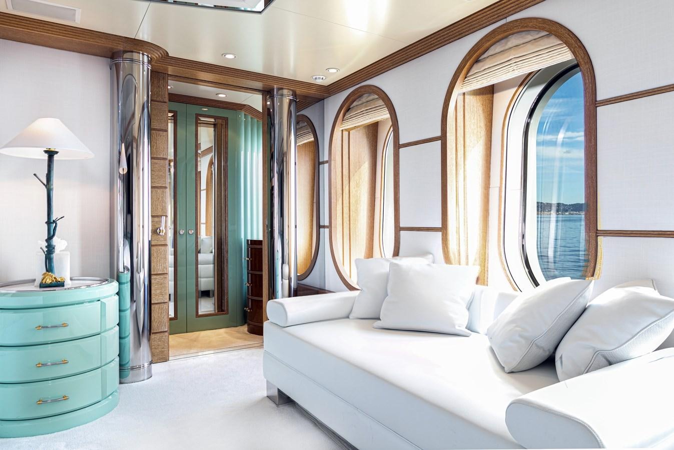 a room with a bed and a mirror aboard SEA HUNTRESS Yacht for Sale