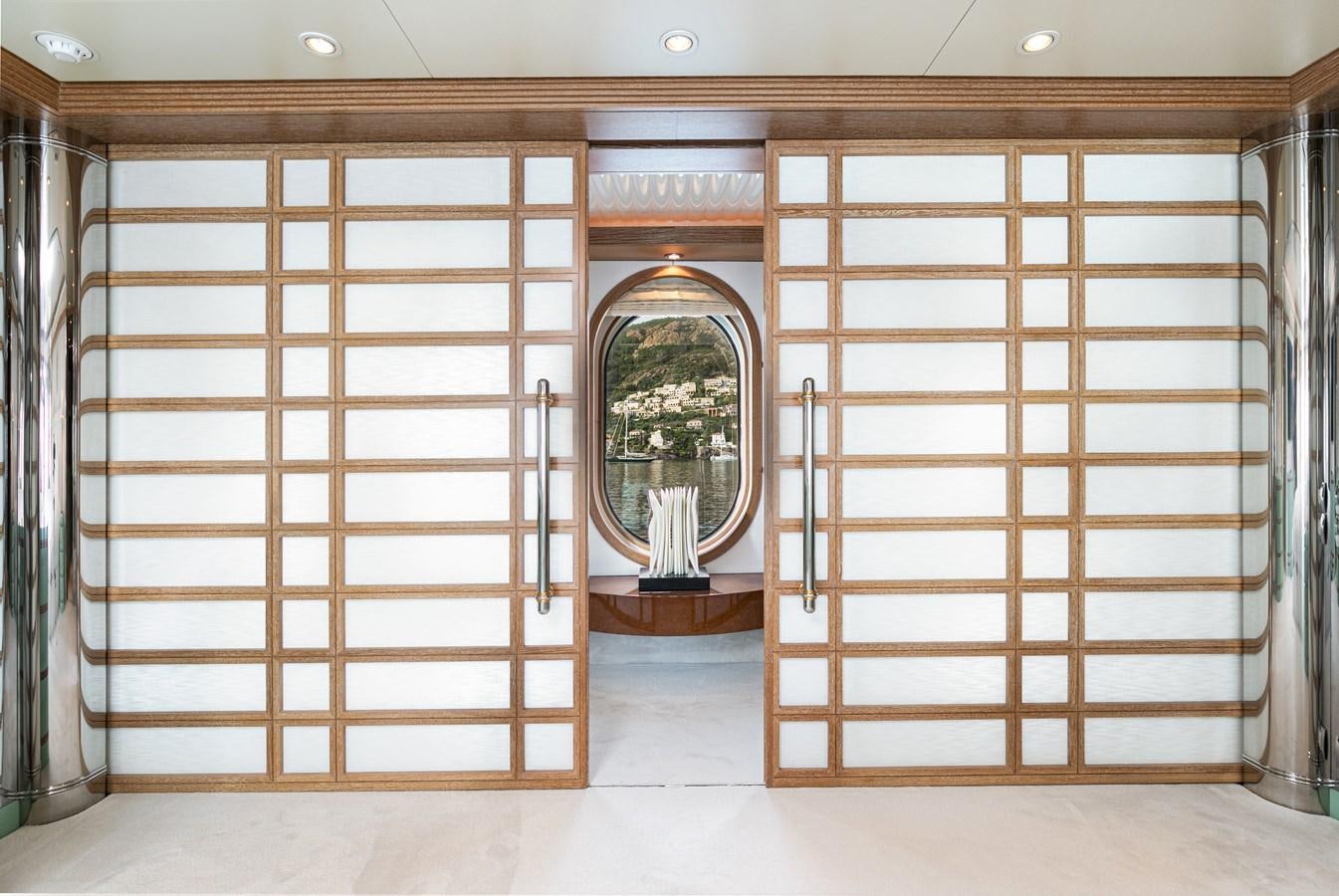 a room with wooden cabinets aboard SEA HUNTRESS Yacht for Sale