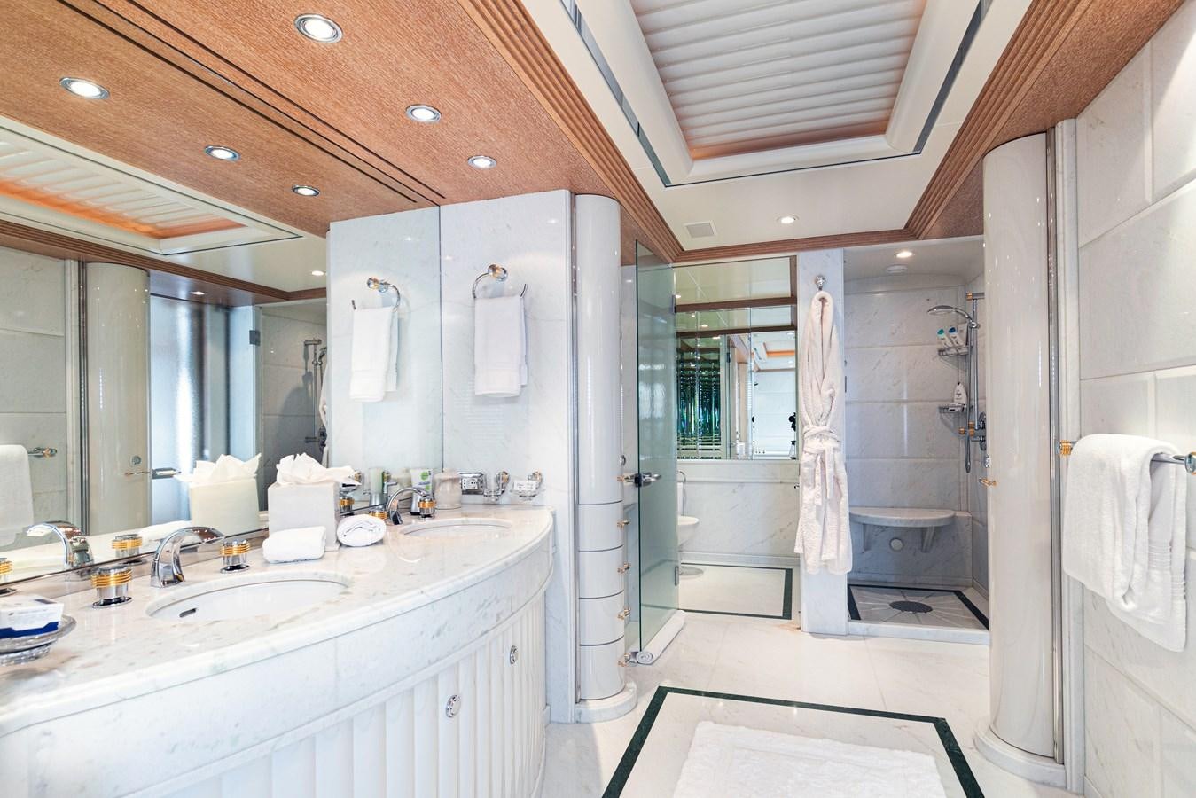a bathroom with a large mirror aboard SEA HUNTRESS Yacht for Sale