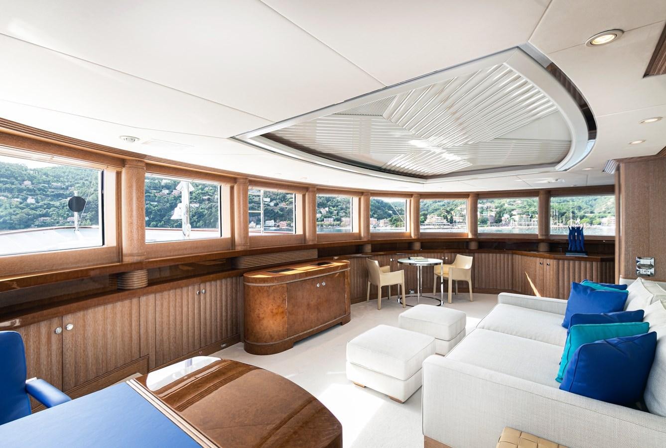 a room with a couch and a table and chairs aboard SEA HUNTRESS Yacht for Sale