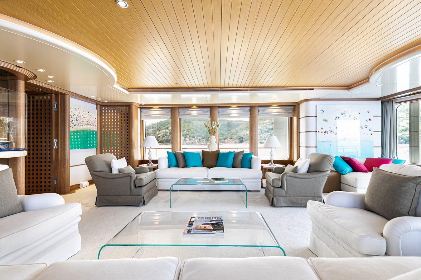 a living room with a large open window aboard SEA HUNTRESS Yacht for Sale