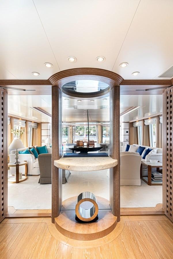a room with a table and chairs aboard SEA HUNTRESS Yacht for Sale