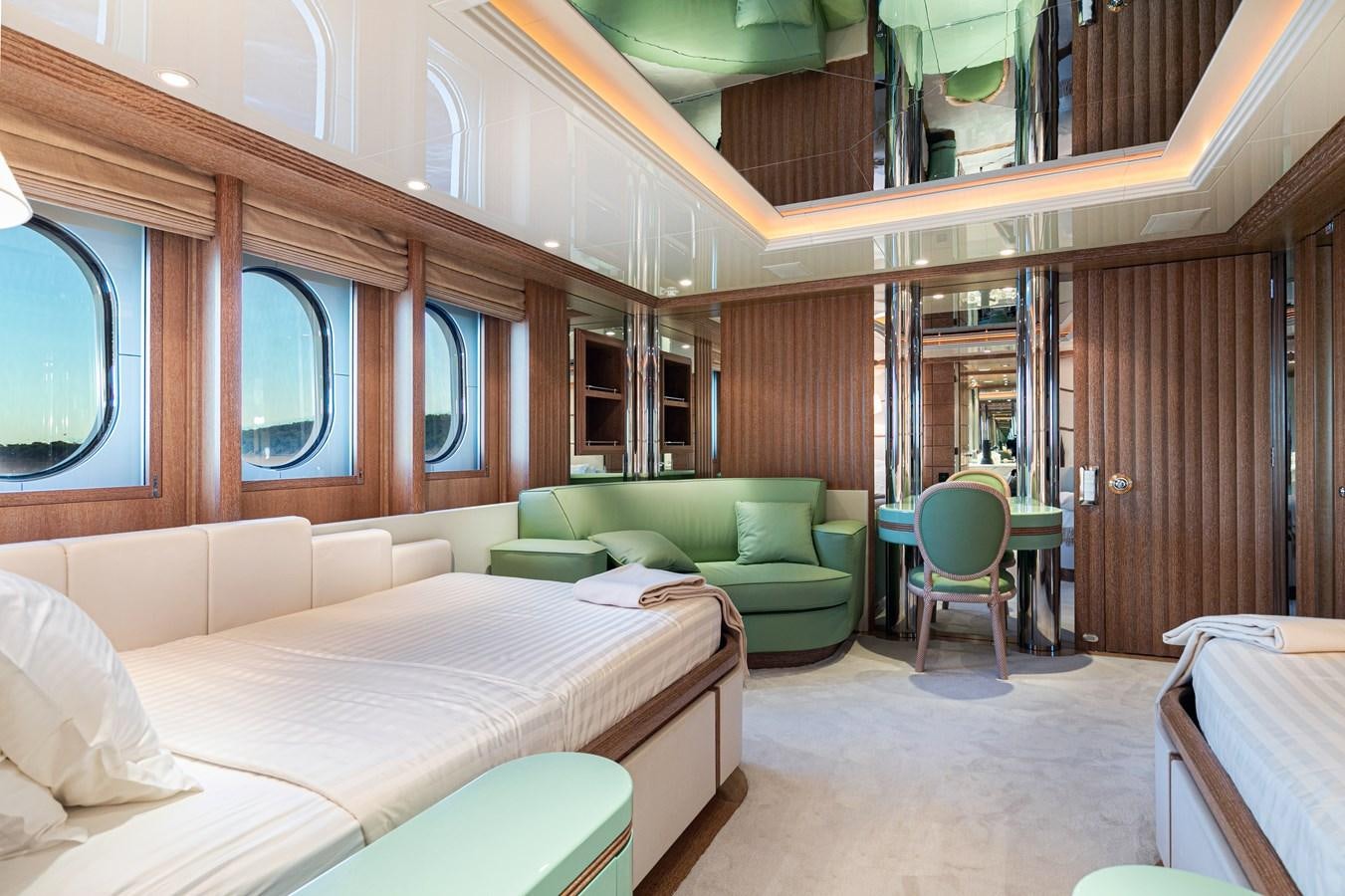 a room with a bed and a couch aboard SEA HUNTRESS Yacht for Sale