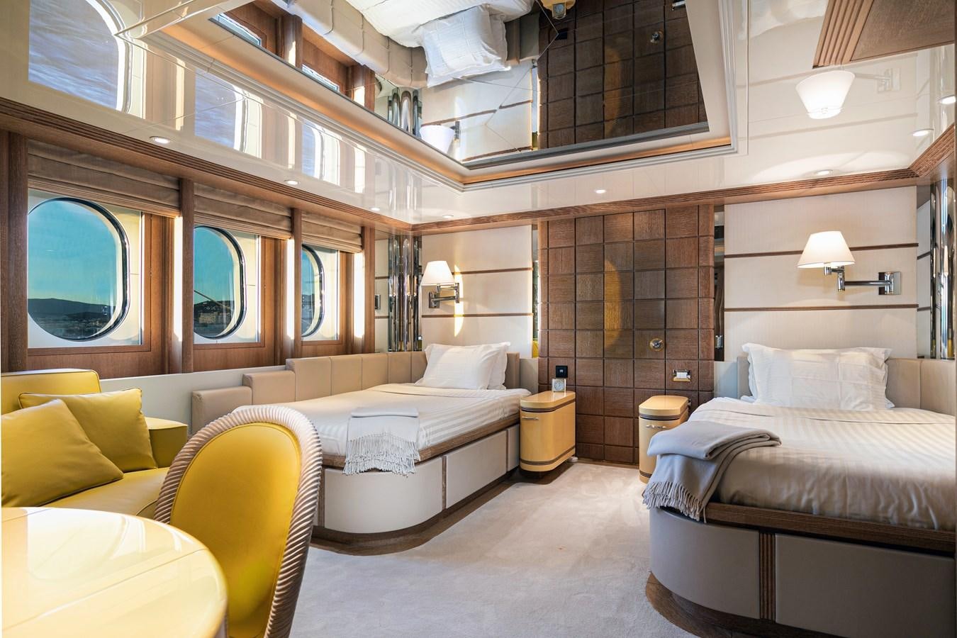 a room with a bed and a couch aboard SEA HUNTRESS Yacht for Sale