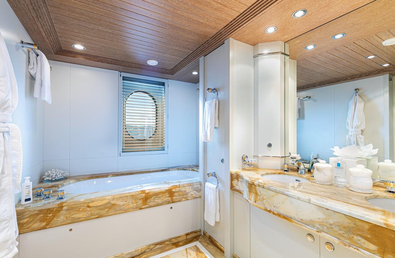 a bathroom with a large tub aboard SEA HUNTRESS Yacht for Sale