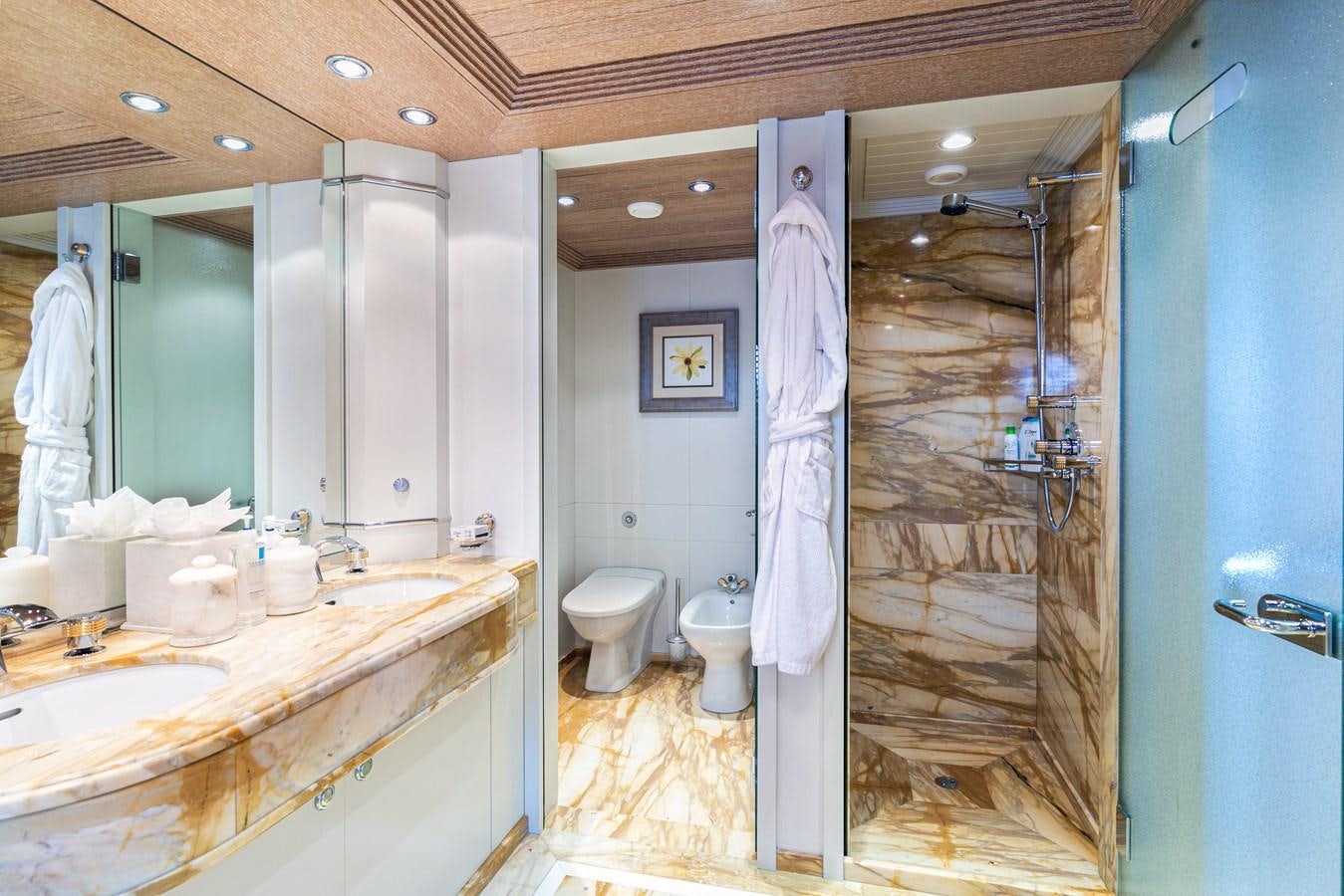 a bathroom with a sink and a shower aboard SEA HUNTRESS Yacht for Sale