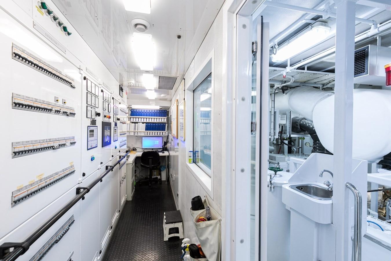 a hallway with white walls aboard SEA HUNTRESS Yacht for Sale