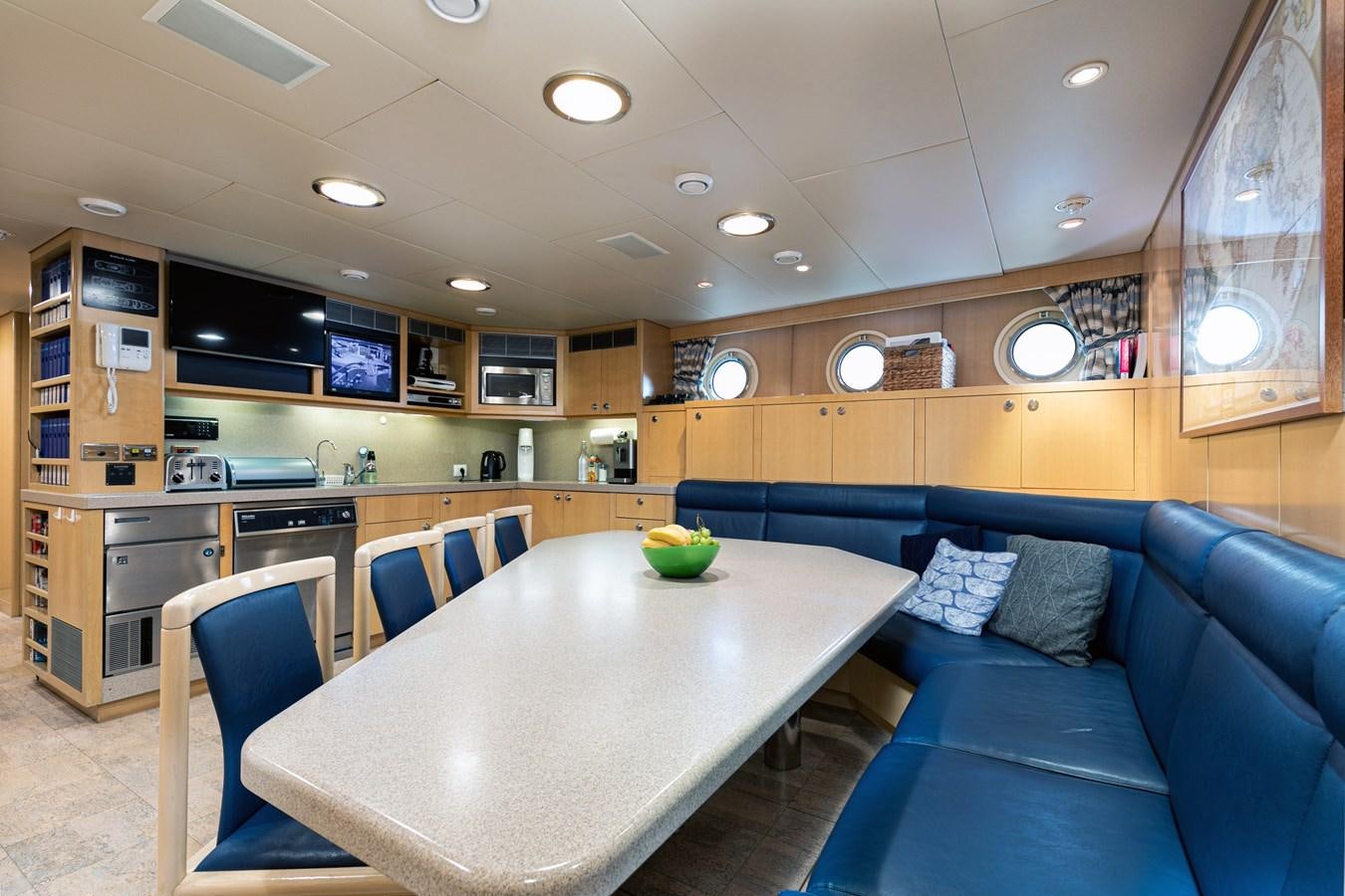 a kitchen and living room aboard SEA HUNTRESS Yacht for Sale