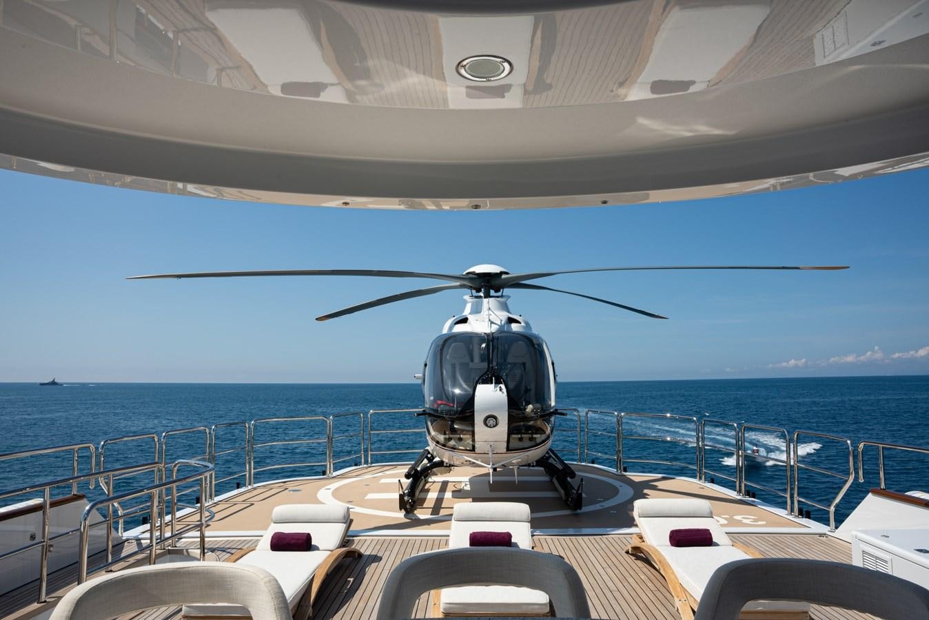 a helicopter on a deck of a ship aboard SEA HUNTRESS Yacht for Sale