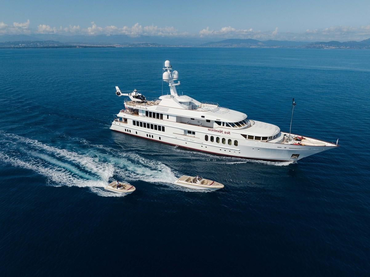 a large white ship in the water aboard SEA HUNTRESS Yacht for Sale