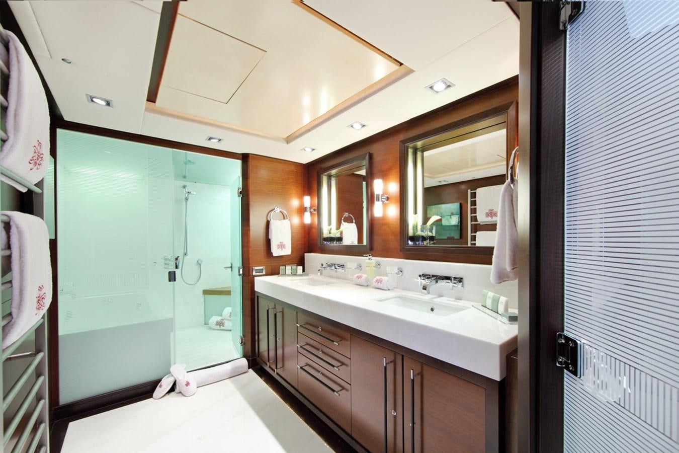 a bathroom with a sink and a mirror aboard PRANA Yacht for Charter