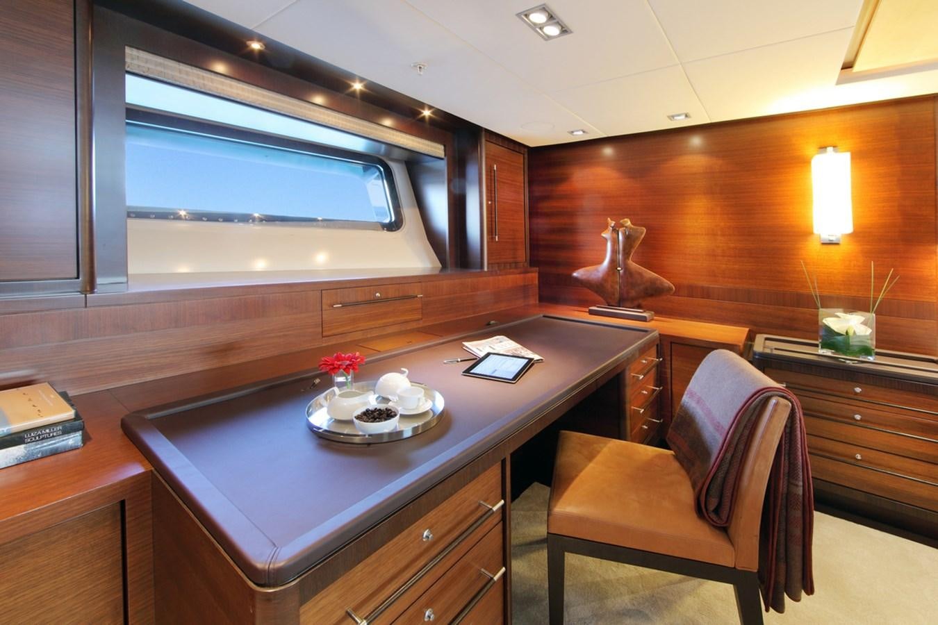 a room with a table and chairs aboard PRANA Yacht for Charter