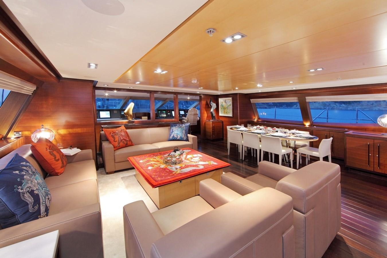 a living room with a large window aboard PRANA Yacht for Charter