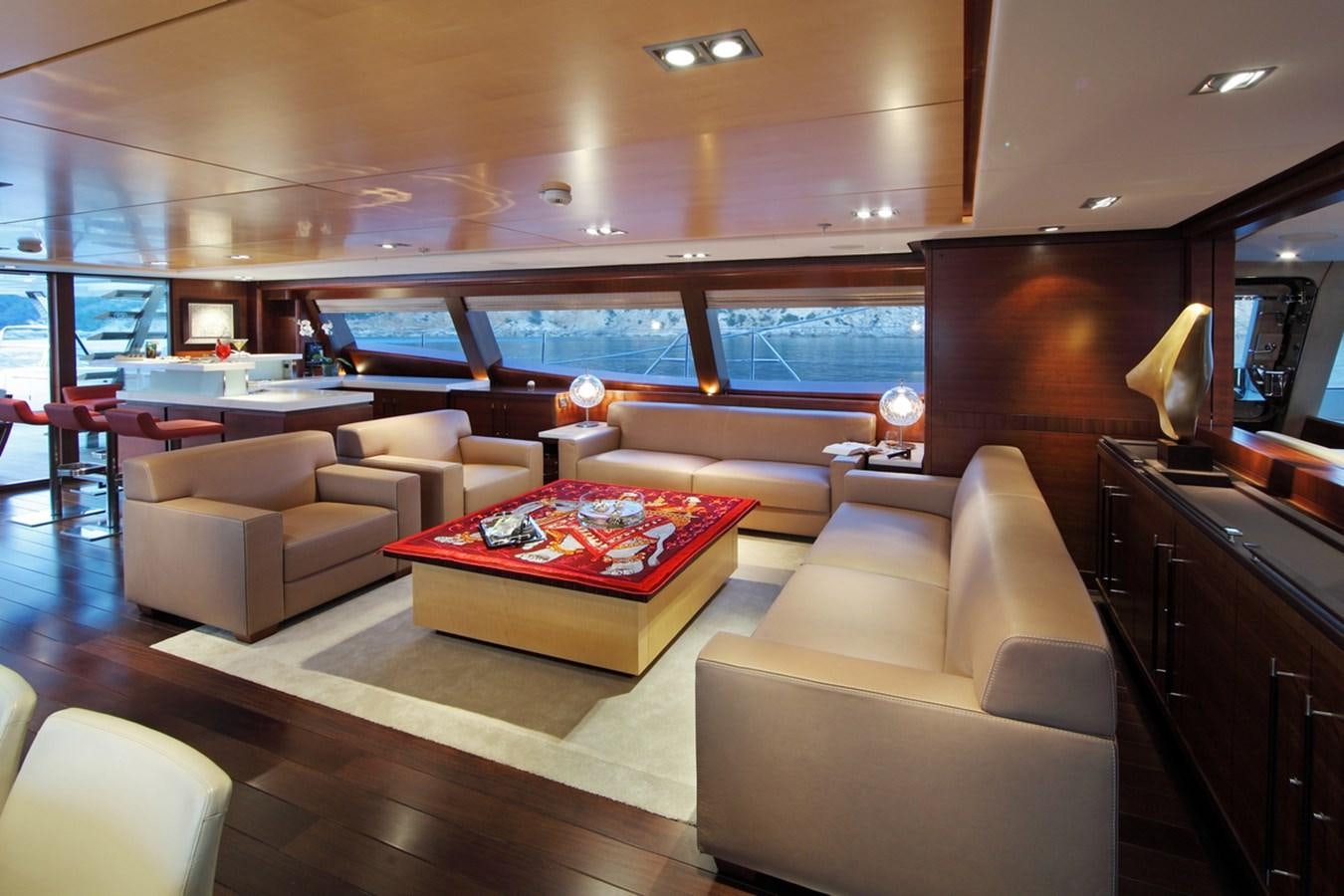 a living room with a large window aboard PRANA Yacht for Charter