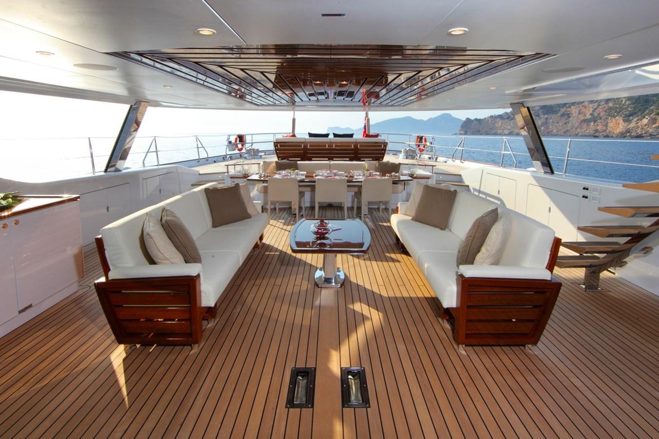 a room with a table and chairs aboard PRANA Yacht for Charter
