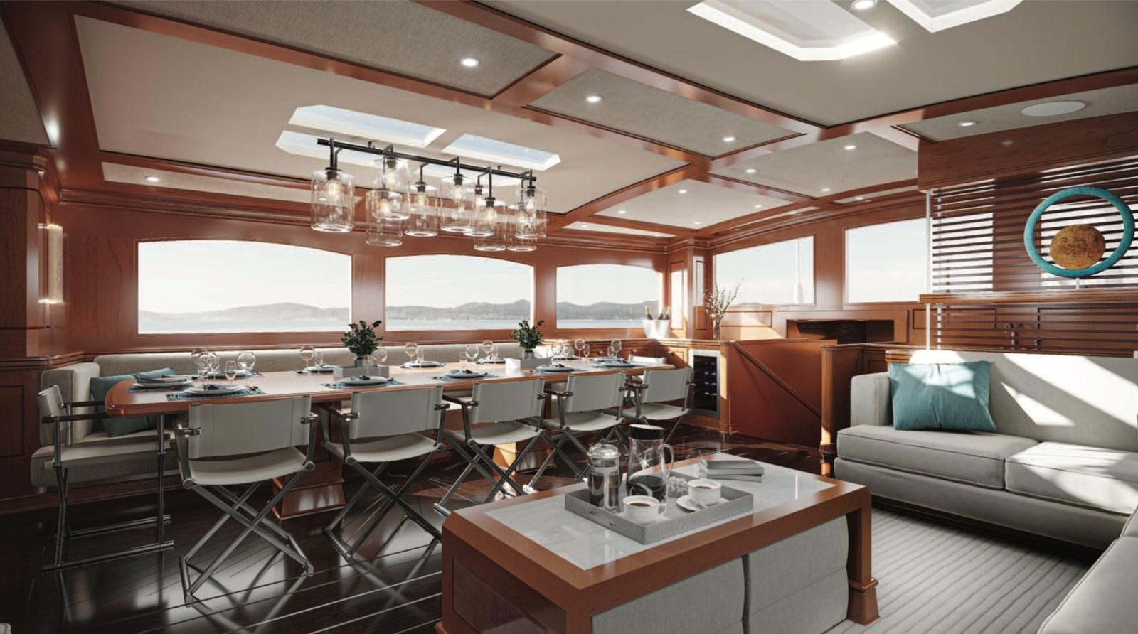 a room with a table and chairs aboard RAINBOW II Yacht for Sale