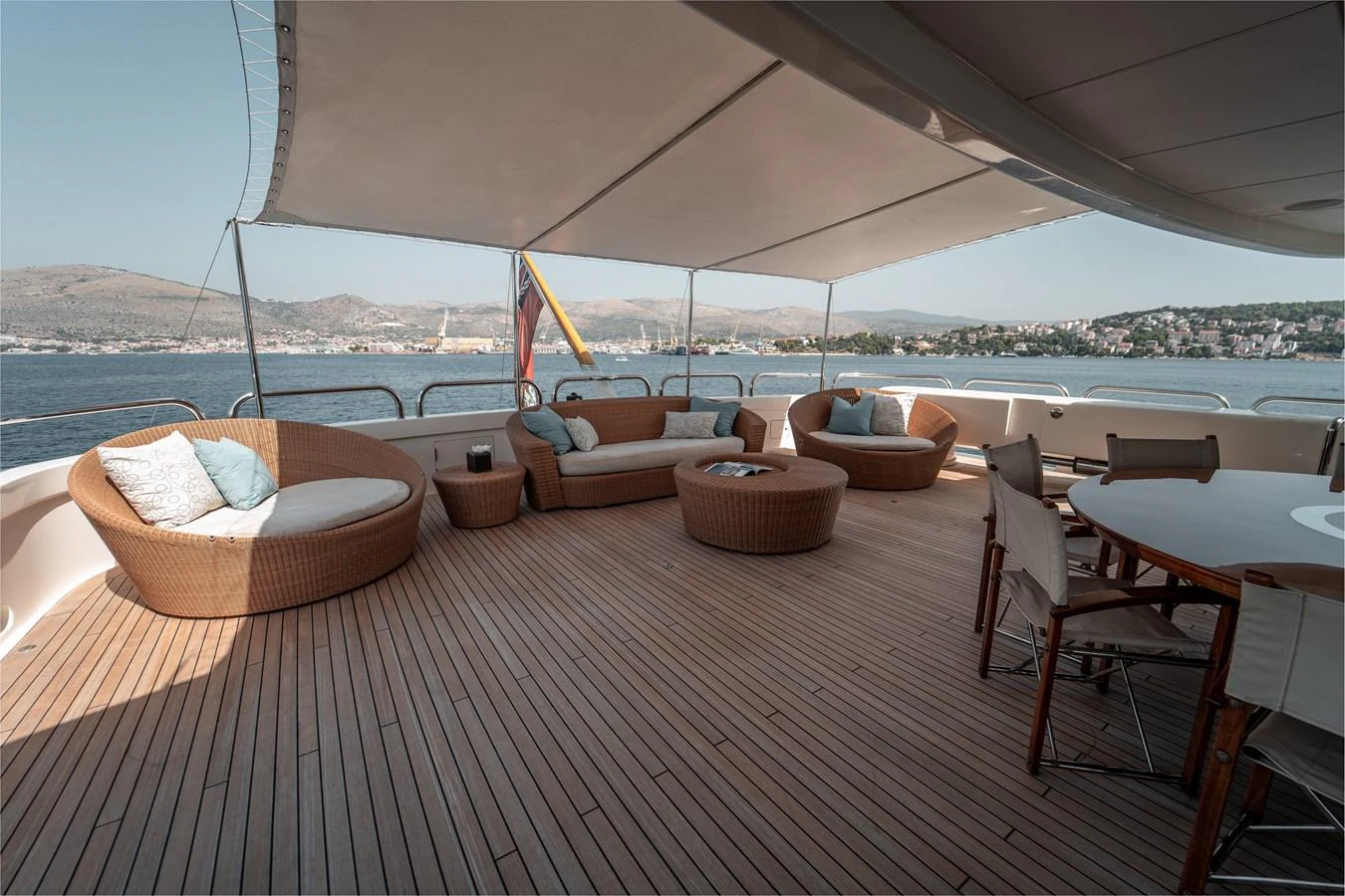a patio with a table and chairs aboard MERCURY Yacht for Sale