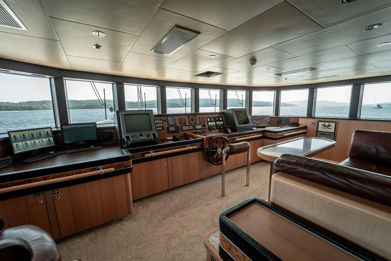 a room with a couch and a television in it aboard MERCURY Yacht for Sale