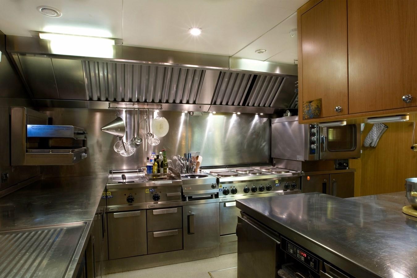 a kitchen with stainless steel appliances aboard QUEEN AIDA Yacht for Sale