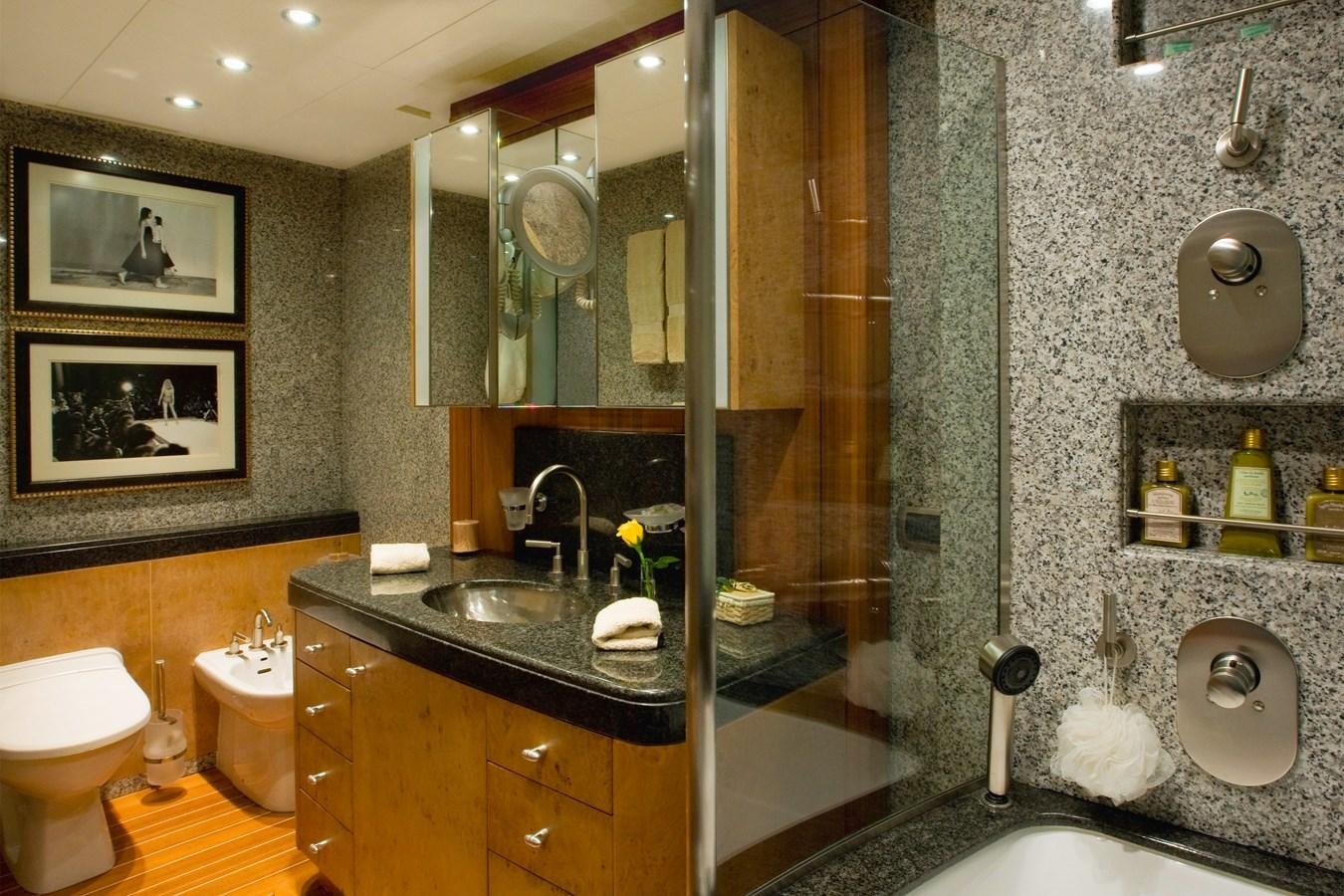 a bathroom with a glass shower aboard QUEEN AIDA Yacht for Sale