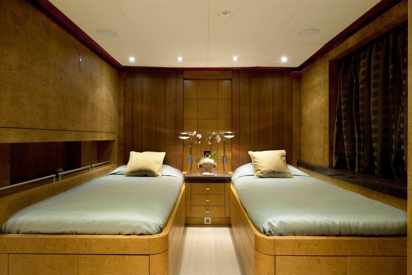 a room with a bed and a mirror aboard QUEEN AIDA Yacht for Sale